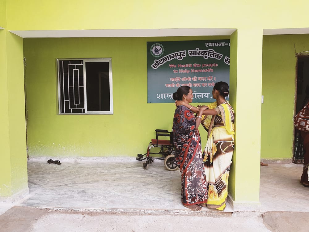 Women’s rights advocates outside a community centre build by CBM’s partner