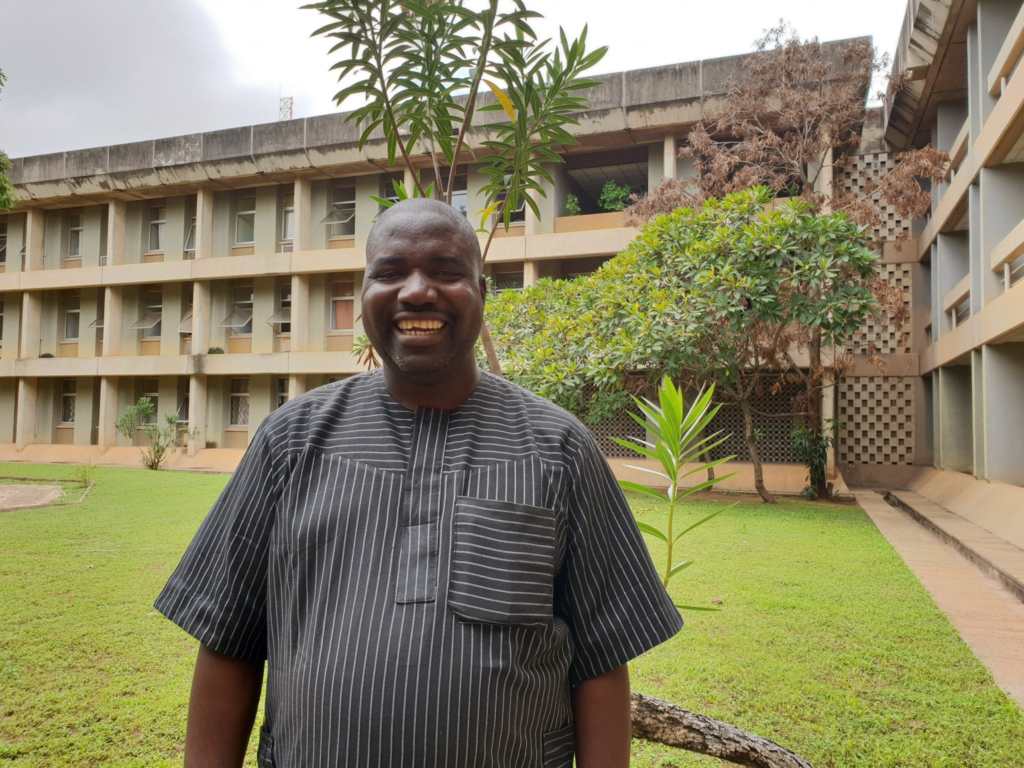 Man standing in front of building.