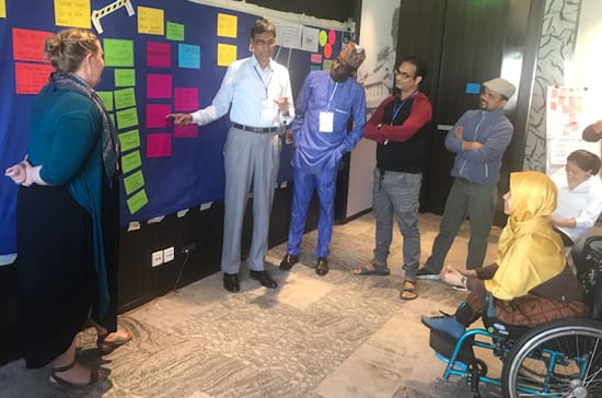Inclusion Advisory Group members and country directors engaged in strategic planning.