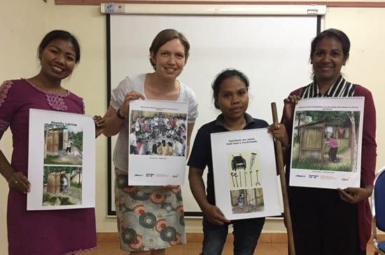 CBM advisor, with WaterAid and DPO staff showing joint resources they developed to support WaterAid community workers to have discussions about disability inclusion and accessibility within their community work In Timor-Leste.