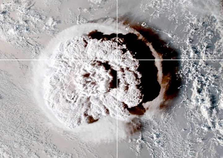 The eruption of an underwater volcano off Tonga, which triggered a tsunami warning for several South Pacific island nations, is seen in an image from the NOAA GOES-West satellite taken at 05:00 GMT January 15, 2022.