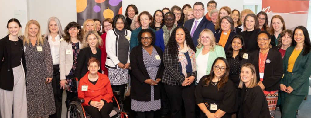 The members of the Micah Women Leaders' Delegation, including the Minister for International Development and the Pacific Pat Conroy, gather inside Parliament House