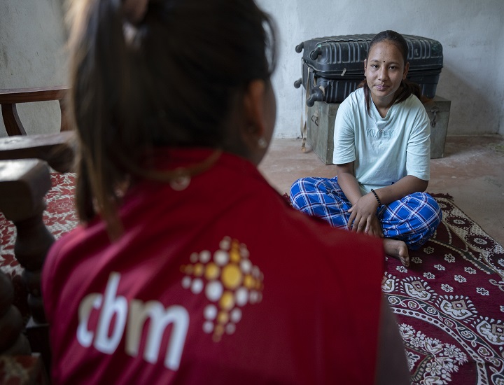 Dilmaya talking to an outreach support worker