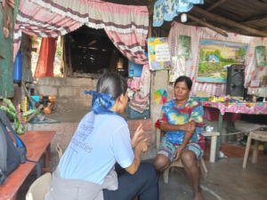 A community health worker chatting to Margie