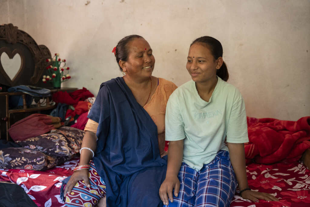 Dilmaya sitting with her Mother