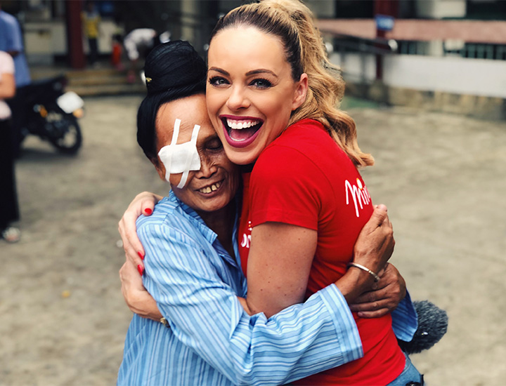 A photo of two woman hugging