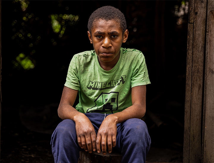 A boy looking towards the camera