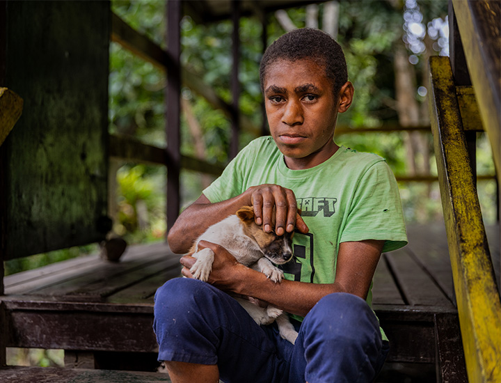 A young boy with a dog