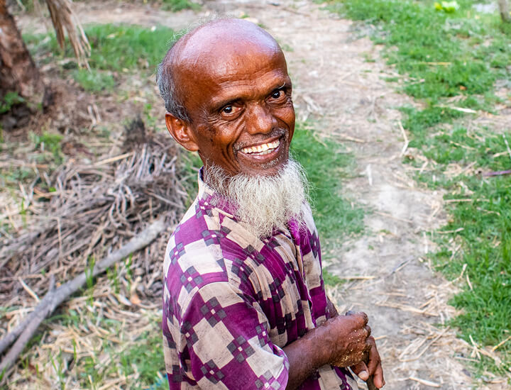 Older man with a big smile.