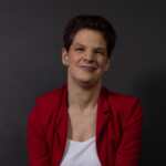 A picture of Stevie Wills, looking directly at the camera and smiling