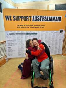 Stevie Wills and Minister Aly sharing a hug